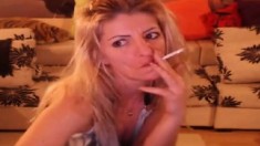 Smoking Blonde Stripteasing And Having Fun On Webcam