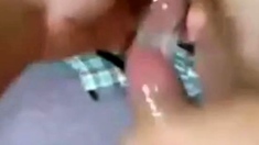 Two Guys Cum Together in a Condom
