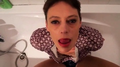 Short hair mature takes facial in the bathtub