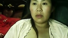 Wetting pussy of lonely Chinese MILF